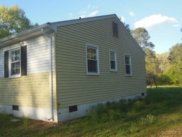 view of property exterior with crawl space