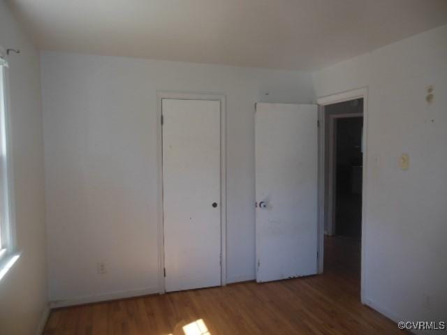 unfurnished bedroom featuring wood finished floors