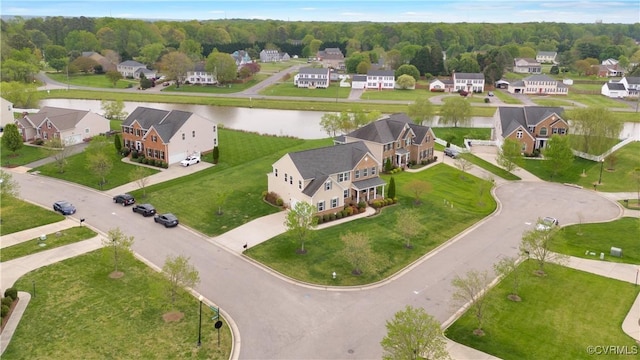 aerial view of residential area featuring a nearby body of water