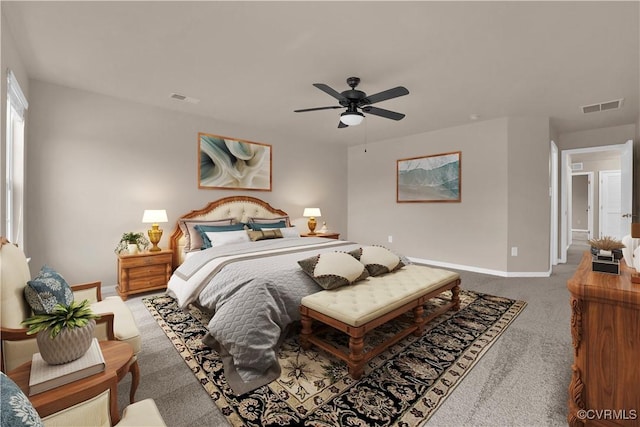 carpeted bedroom with baseboards and a ceiling fan