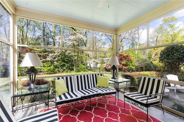 sunroom with a ceiling fan