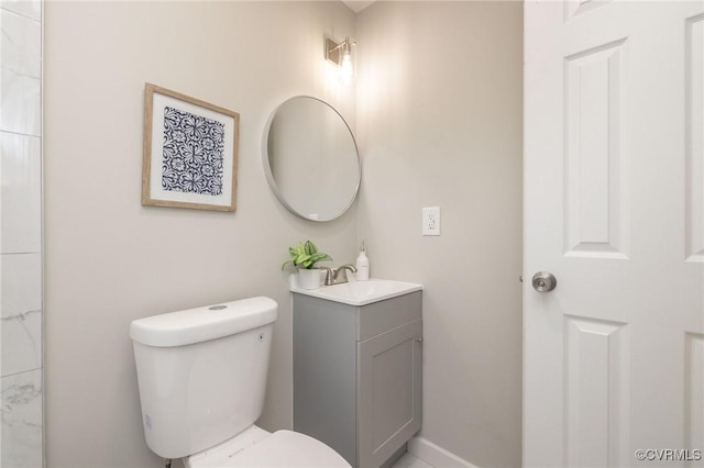 bathroom featuring toilet and vanity