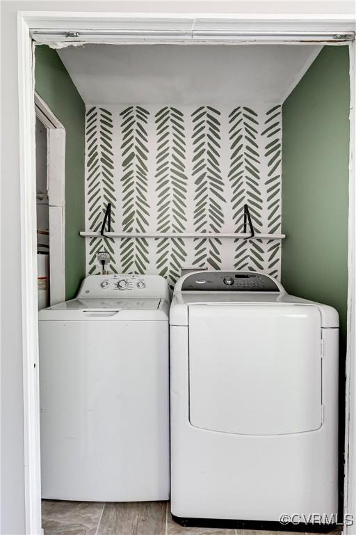 clothes washing area with laundry area and washer and dryer