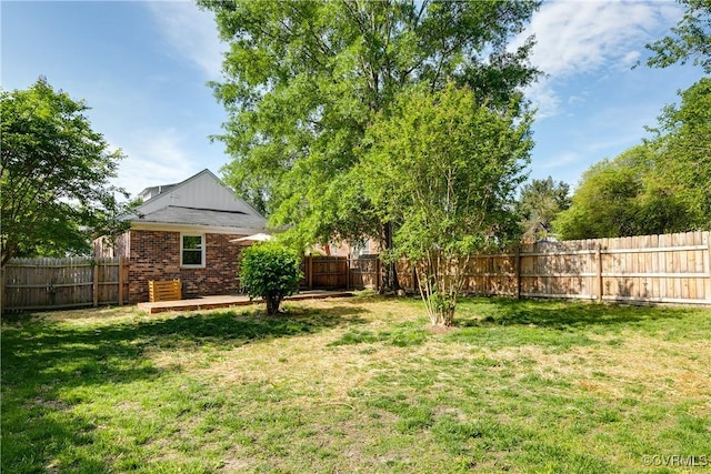 view of yard with a fenced backyard