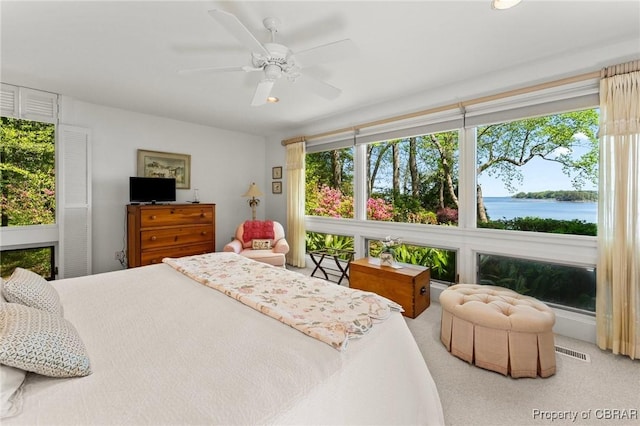 bedroom featuring a ceiling fan and visible vents