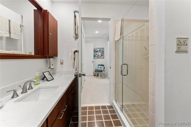 bathroom featuring vanity, recessed lighting, and a stall shower