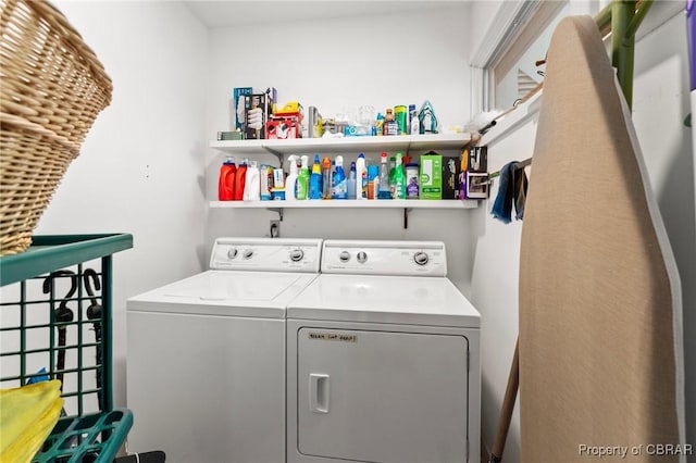 laundry area featuring washing machine and dryer and laundry area