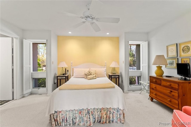 bedroom featuring recessed lighting, carpet floors, ceiling fan, and multiple windows