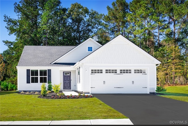 4140 Courthouse Rd, Prince George, VA 23875 - view of front facade with an attached garage, asphalt driveway, a front lawn, and a shingled roof