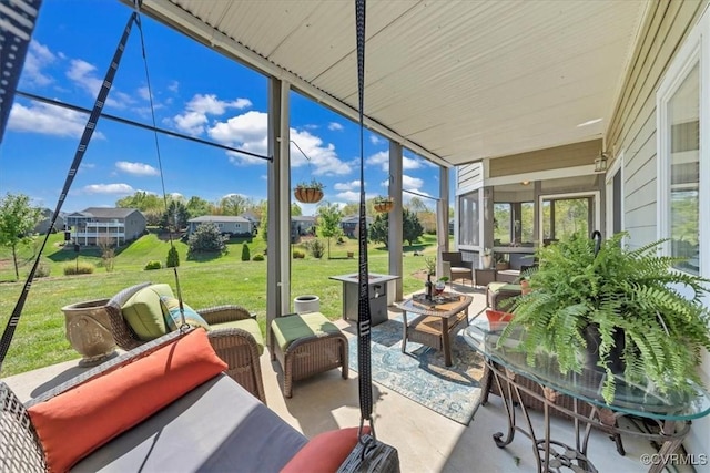 sunroom featuring an outdoor living space