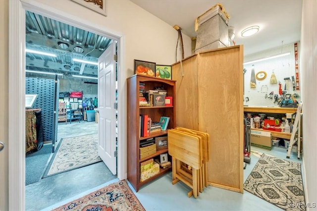 interior space featuring finished concrete floors