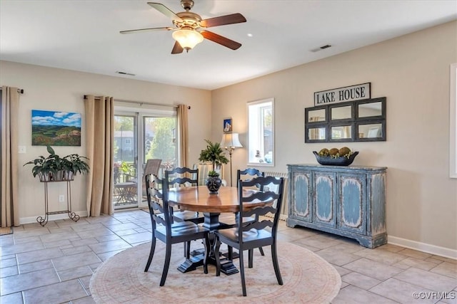 dining area with baseboards, ceiling fan, and visible vents