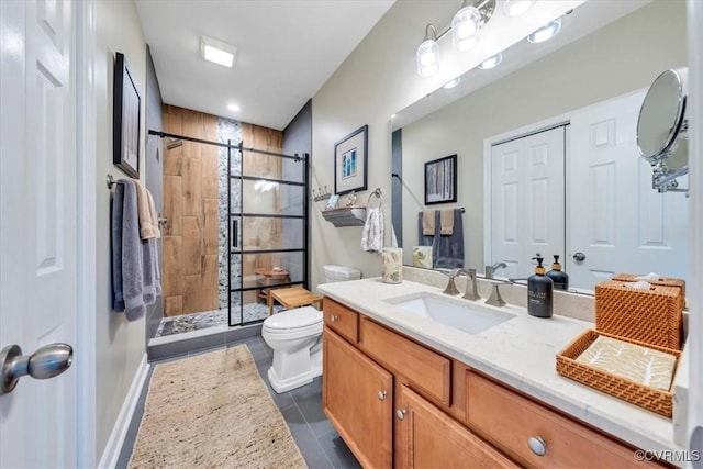 full bathroom with vanity, tile patterned floors, a stall shower, and toilet