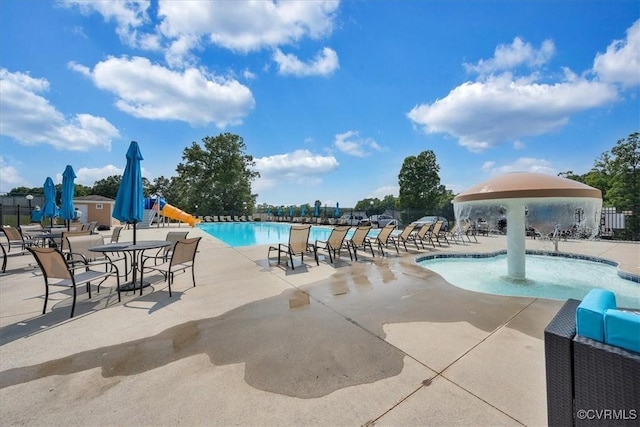 pool with fence and a patio area