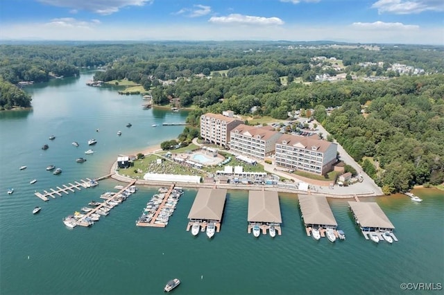 birds eye view of property featuring a view of trees and a water view