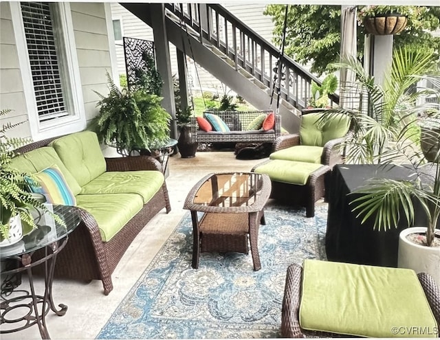 exterior space with stairway, an outdoor hangout area, and a patio area