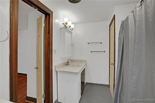 full bath with tile patterned floors and vanity