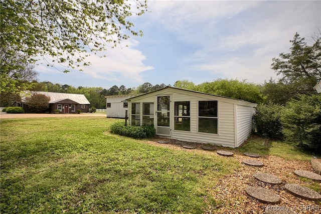 back of house with a yard