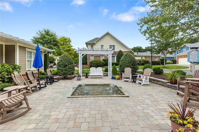 view of patio featuring a pergola and an outdoor fire pit