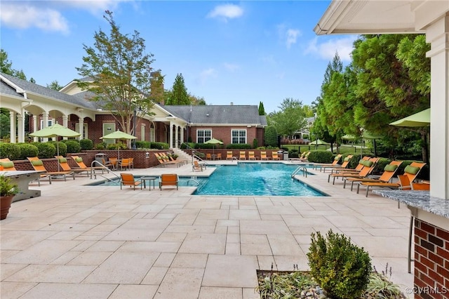 pool with a patio area