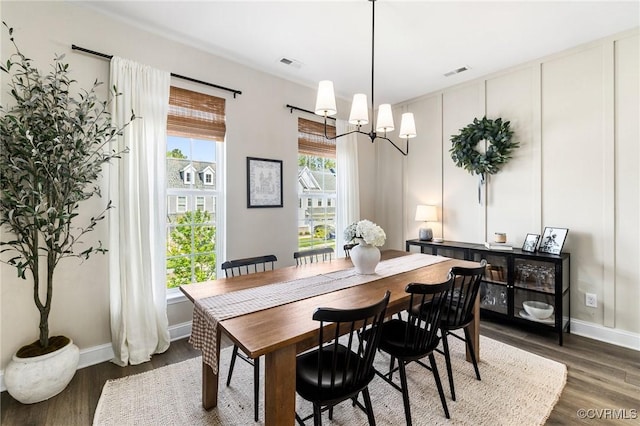 6812 Leire Ln, Chesterfield, VA 23832 - dining area with a chandelier, dark wood finished floors, and baseboards