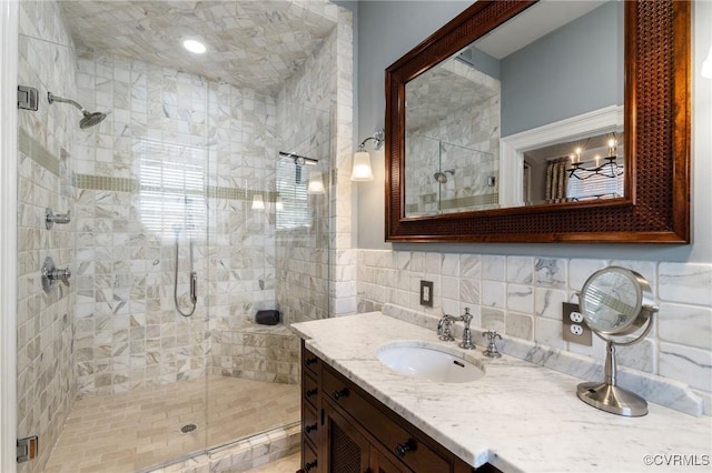 bathroom with vanity and a stall shower