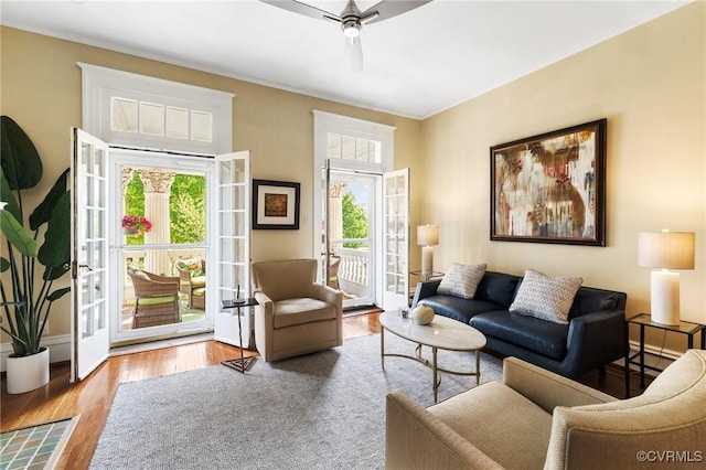 living room featuring ceiling fan and wood finished floors