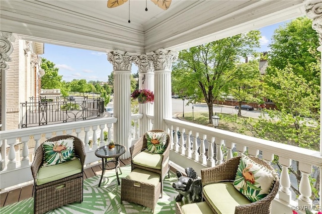 balcony featuring ceiling fan and a porch