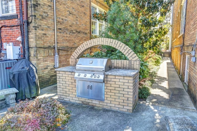 view of patio / terrace featuring exterior kitchen and area for grilling