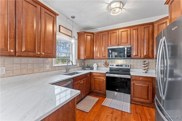8500 Baldwin Creek Rd, Chesterfield, VA 23832 - kitchen with a sink, appliances with stainless steel finishes, and brown cabinets