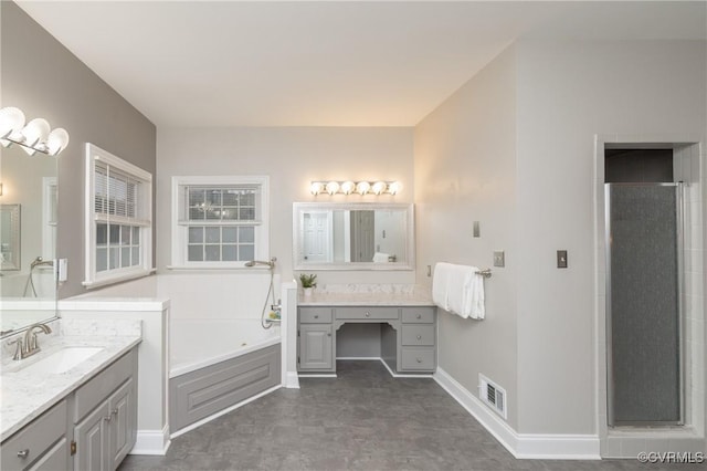 4900 Wellington Farms Dr, Chester, VA 23831 - full bath featuring a bath, two vanities, and a shower stall