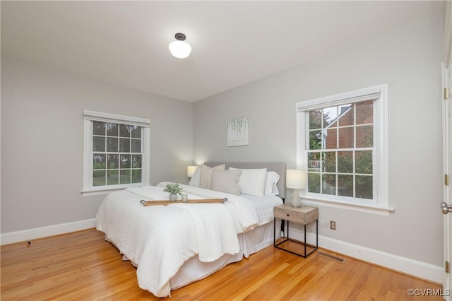 4900 Wellington Farms Dr, Chester, VA 23831 - bedroom featuring baseboards and wood finished floors