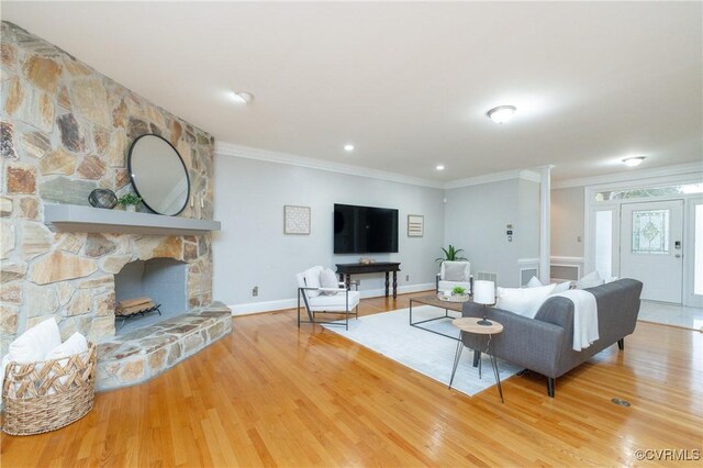 4900 Wellington Farms Dr, Chester, VA 23831 - living room featuring wood finished floors, ornamental molding, and a fireplace