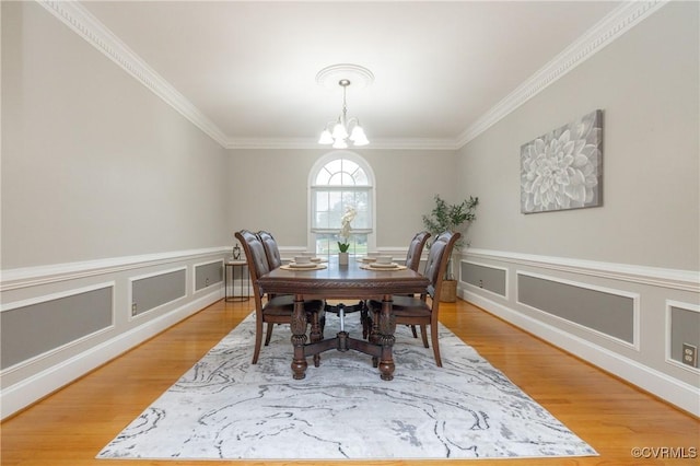 4900 Wellington Farms Dr, Chester, VA 23831 - dining area with ornamental molding, a chandelier, light wood-style floors, and wainscoting