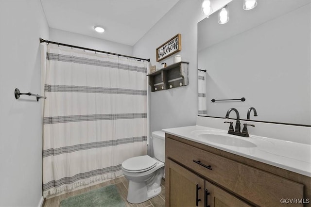 full bathroom featuring vanity, wood finished floors, toilet, and a shower with curtain