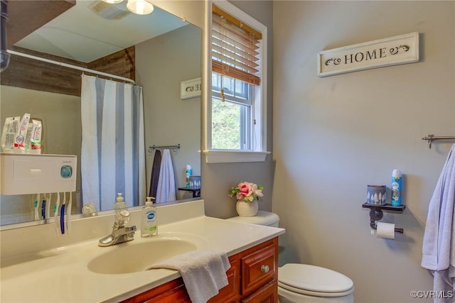 6360 Haleford Dr, Powhatan, VA 23139 - bathroom with toilet, vanity, ceiling fan, and curtained shower