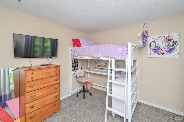 bedroom with baseboards, carpet flooring, and a textured ceiling