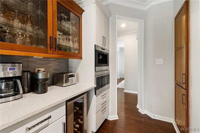 3702 Maher Mnr, Glen Allen, VA 23060 - bar area with wine cooler, crown molding, dark wood-type flooring, stainless steel double oven, and baseboards