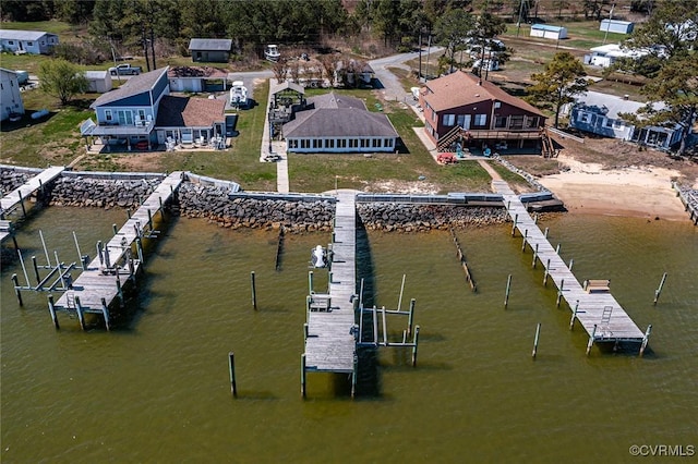 dock area featuring a deck with water view