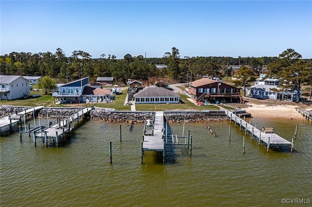 dock area featuring boat lift and a water view
