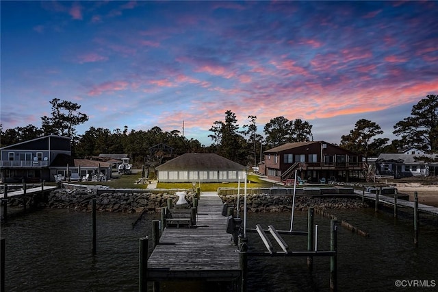 view of dock featuring boat lift and a water view