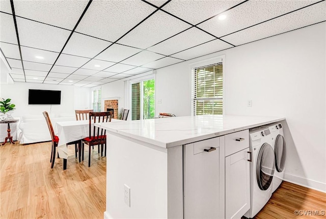 10278 Henderson Hall Rd, Mechanicsville, VA 23116 - washroom with recessed lighting, washer and clothes dryer, baseboards, cabinet space, and light wood-style flooring