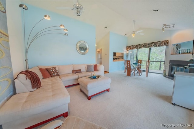 living room with high vaulted ceiling, ceiling fan, carpet flooring, and visible vents