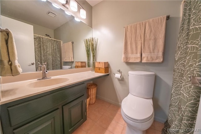 full bath featuring toilet, vanity, tile patterned floors, and baseboards