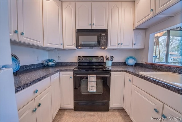 kitchen featuring white cabinets, dark countertops, a sink, and black appliances