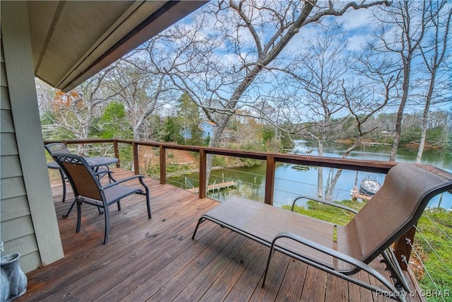 wooden deck featuring a water view