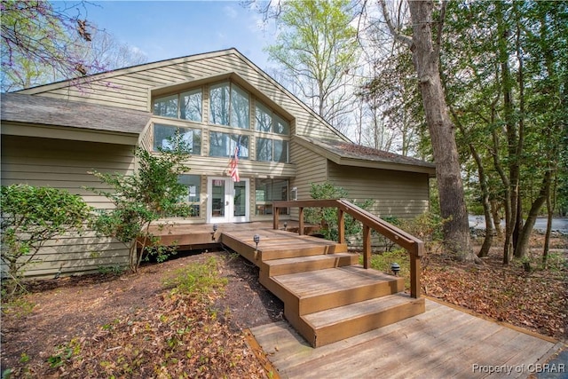 back of property featuring french doors and a deck