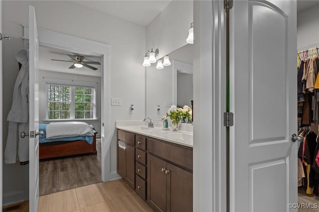 5530 Tyshire Pkwy, Providence Forge, VA 23140 - bathroom with ceiling fan, double vanity, connected bathroom, and a walk in closet