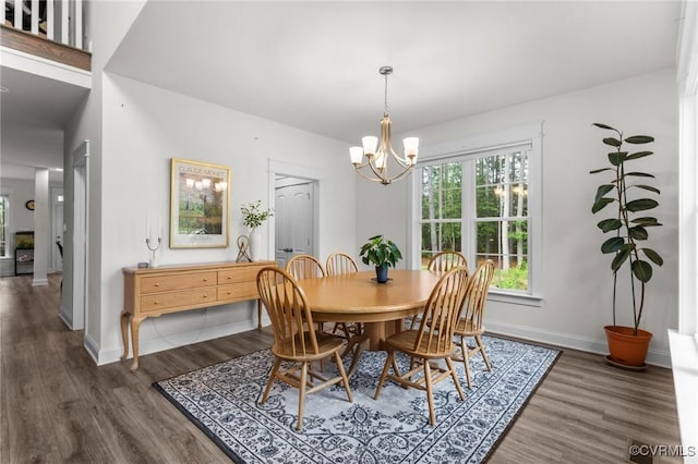 5530 Tyshire Pkwy, Providence Forge, VA 23140 - dining area with dark wood finished floors, a chandelier, and baseboards