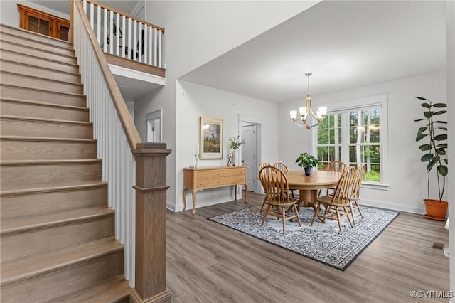 5530 Tyshire Pkwy, Providence Forge, VA 23140 - dining area featuring stairs, wood finished floors, baseboards, and a chandelier